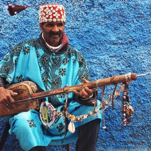 Gnawa musician holding a guembri