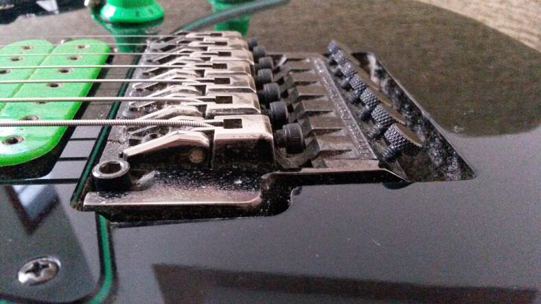Seven strings and Lo Pro Edge tremolo bridge on an Ibanez Universe guitar